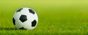 Soccer ball on grass with copy space